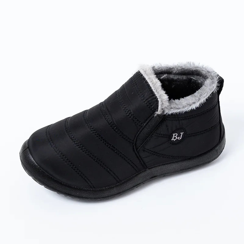 Black padded snow boot with grey fleece lining and side elastic gore, angled view showing channel-quilted nylon construction and grip rubber sole with heel pull tab