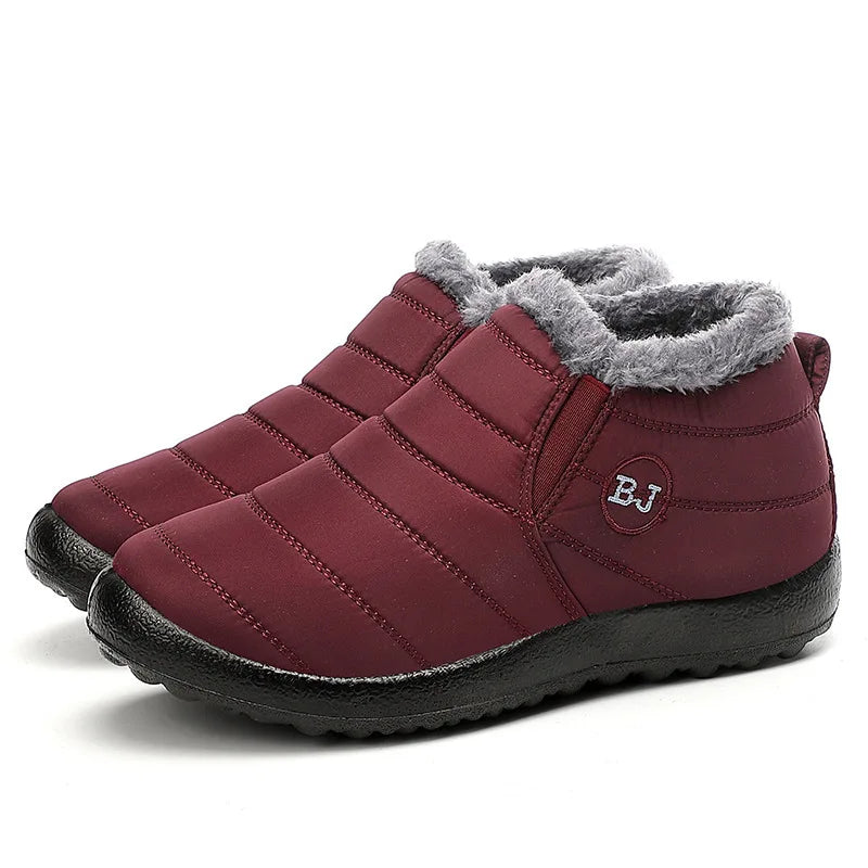 Burgundy quilted ankle boots with grey faux fur collar lining and elastic side gusset, paired three-quarter view showing padded nylon upper and textured rubber sole