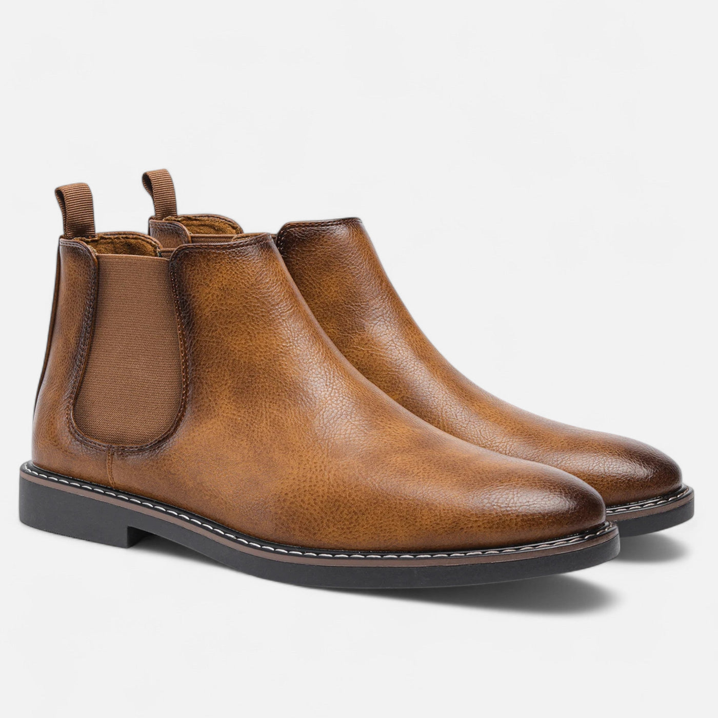 Camel tan leather slip-on Chelsea boots with brown elastic gores and webbing pull tabs, paired display showing natural grain texture and Goodyear welt construction with rubber outsole