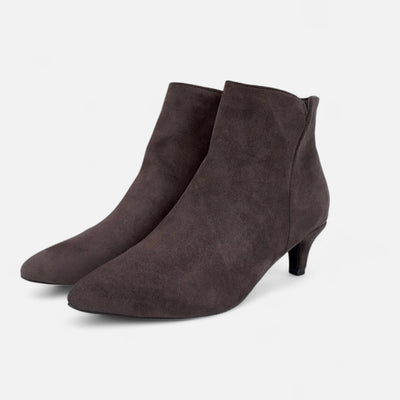 Charcoal grey suede pointed toe ankle boot with kitten heel construction, side profile view showing streamlined silhouette and tapered heel design