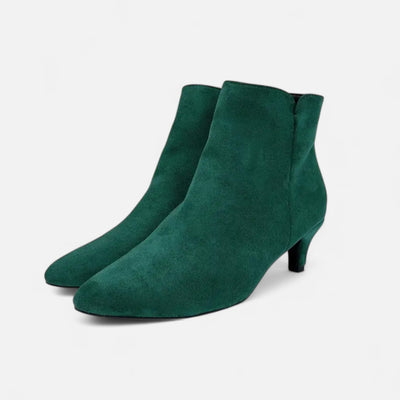 Emerald green suede low heel booties with almond toe shape and concealed side zipper, paired angled view displaying slim kitten heel and soft suede texture