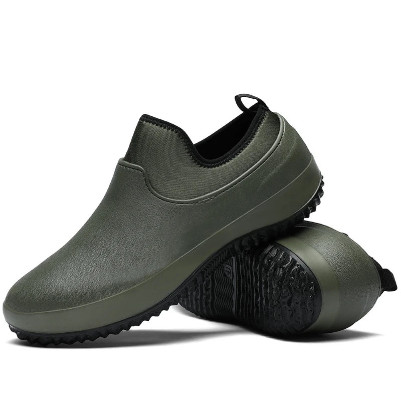 Olive green slip-on mules with black stretch collar and matching green rubber sole, paired stacked perspective showing seamless upper and multi-directional tread pattern