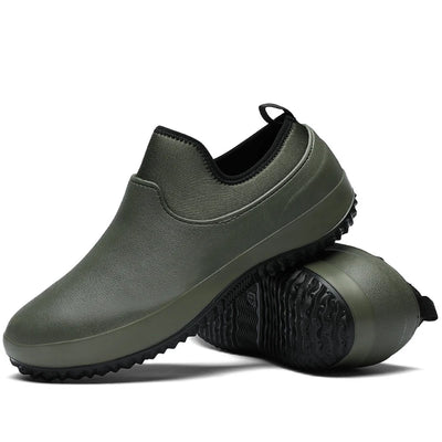 Olive green slip-on mules with black stretch collar and matching green rubber sole, paired stacked perspective showing seamless upper and multi-directional tread pattern