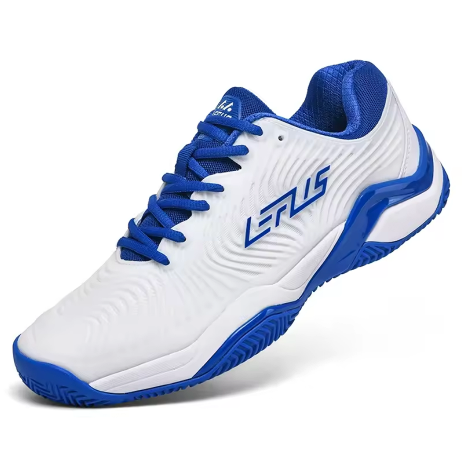 White synthetic tennis court shoe with royal blue laces and trim, diagonal three-quarter view showing embossed wave pattern upper and herringbone traction sole